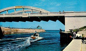 A view of the original bridge over the inlet, sometimes called Rainbow Bridge or Old McDonald Bridge for its twin arches
